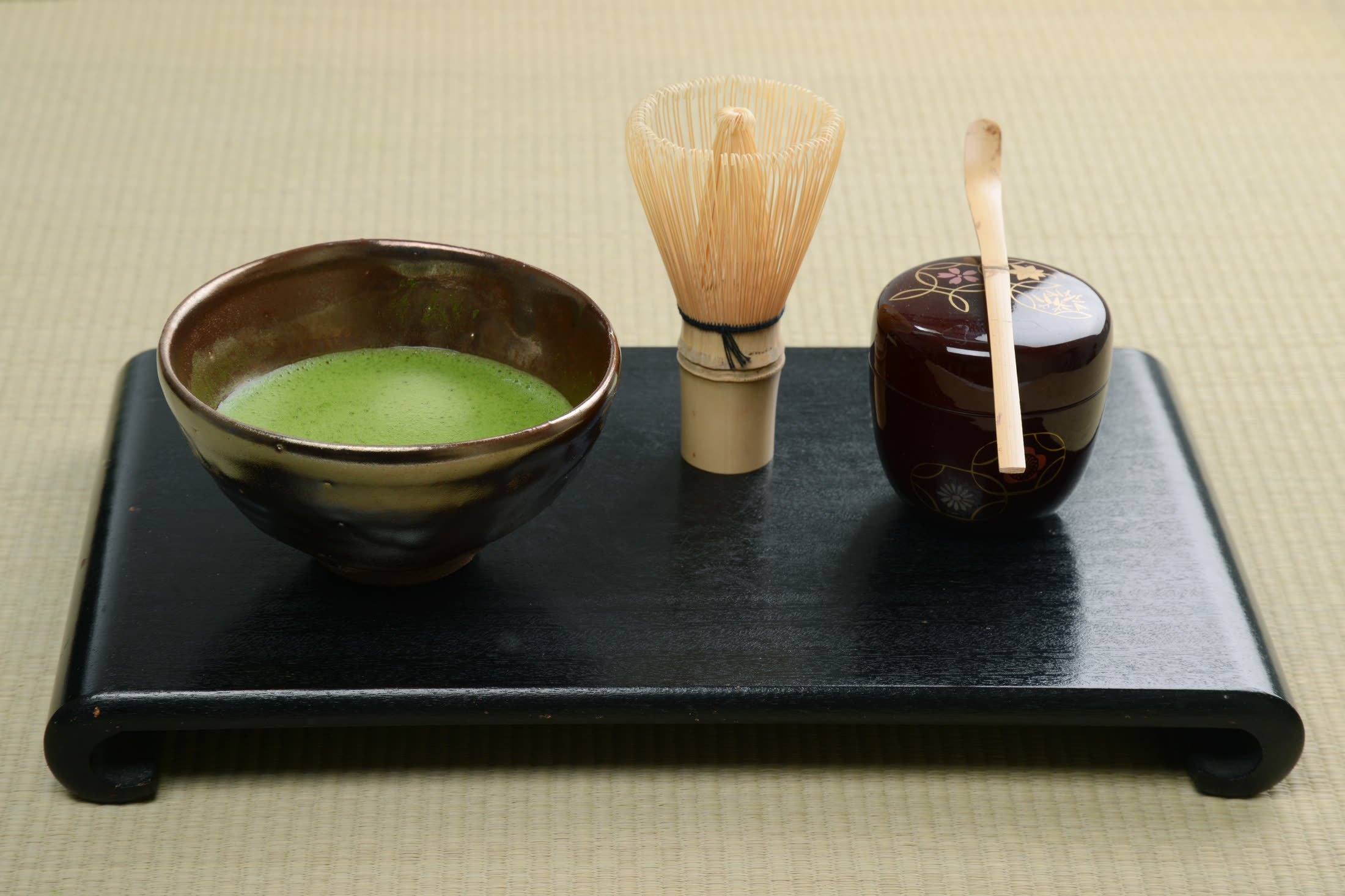 Prepared matcha and service tools arranged on a tray